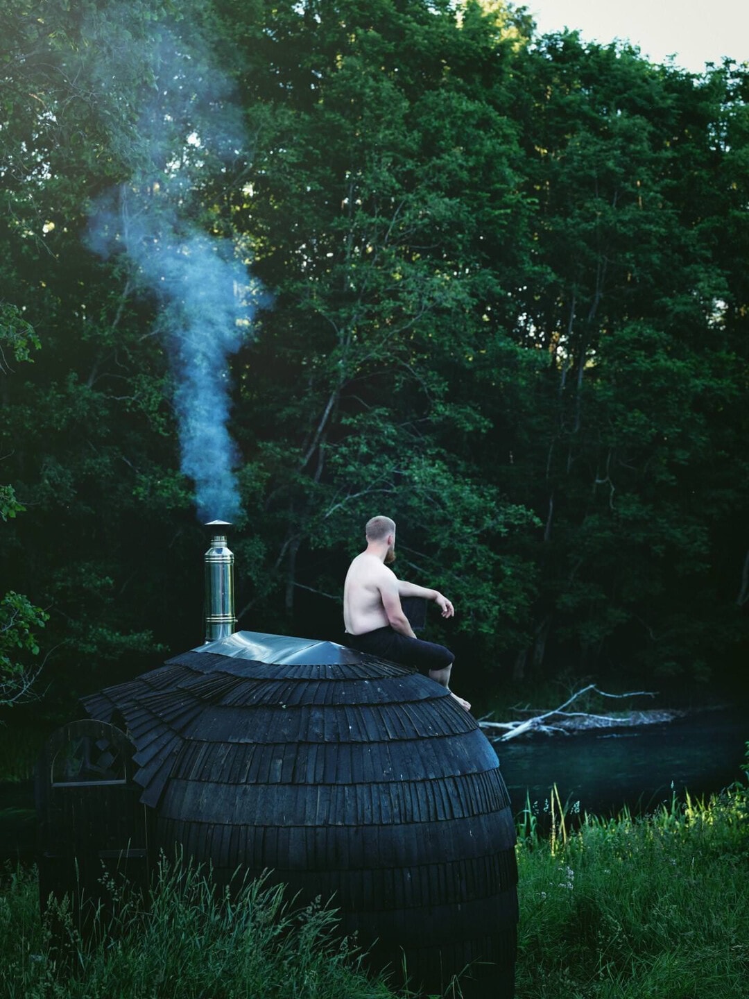 Man on top of a sauna relaxing